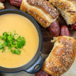 Everything Bagel Pretzel Wrapped Beef Brats with Beer Cheese